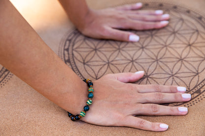 Yoga girl wearing natural gemstone beaded bracelet for strength